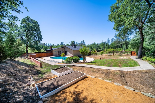 20035 Old Alturas Rd, Redding, CA 96003 - view of yard with a fenced in pool, a fenced backyard, and a garden