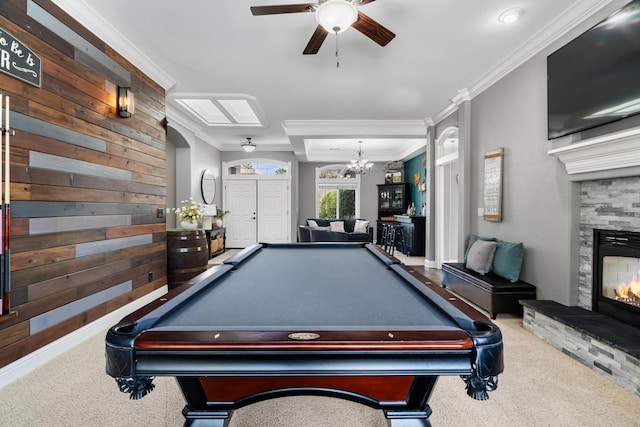2796 Madison River Dr, Redding, CA 96002 - rec room featuring ornamental molding, a stone fireplace, carpet, and ceiling fan with notable chandelier
