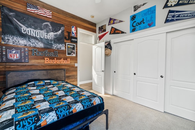 2796 Madison River Dr, Redding, CA 96002 - bedroom featuring a closet, wood walls, and carpet