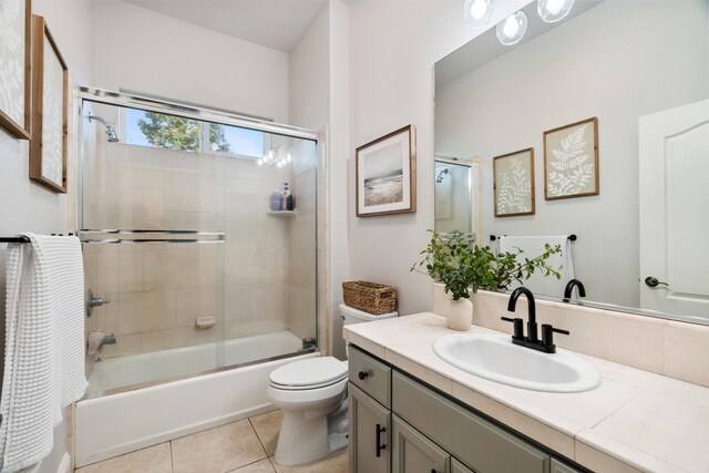 2796 Madison River Dr, Redding, CA 96002 - bathroom with toilet, shower / bath combination with glass door, vanity, and tile patterned flooring