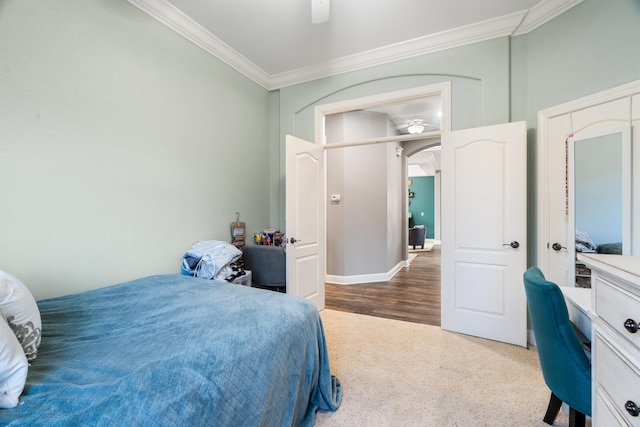 2796 Madison River Dr, Redding, CA 96002 - bedroom with baseboards, arched walkways, ornamental molding, ceiling fan, and carpet