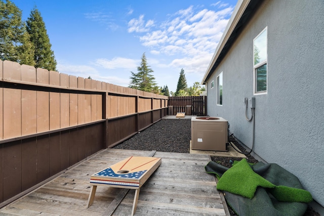 2796 Madison River Dr, Redding, CA 96002 - view of patio / terrace with central air condition unit, a fenced backyard, and a wooden deck