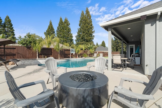 2796 Madison River Dr, Redding, CA 96002 - view of swimming pool featuring a fenced backyard, a fenced in pool, a fire pit, and a patio