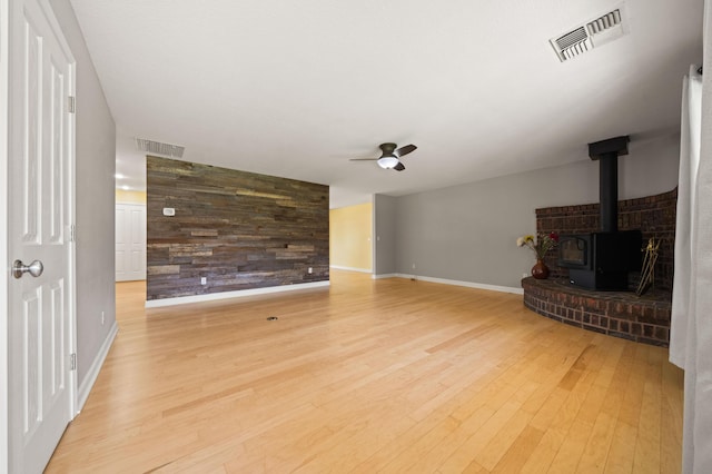 19702 Midland Dr, Redding, CA 96003 - unfurnished living room with visible vents, baseboards, a ceiling fan, and light wood finished floors