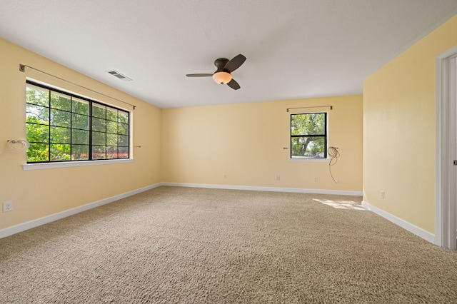 19702 Midland Dr, Redding, CA 96003 - spare room with visible vents, ceiling fan, carpet flooring, and baseboards