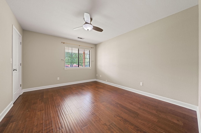 19702 Midland Dr, Redding, CA 96003 - unfurnished room featuring dark wood-type flooring, visible vents, baseboards, and ceiling fan