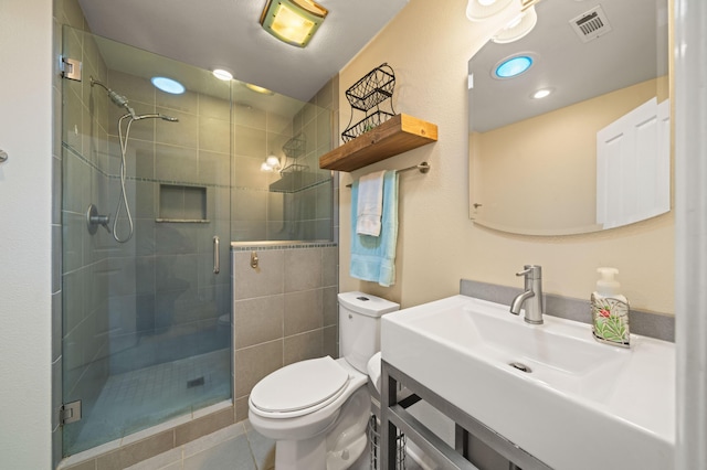 19702 Midland Dr, Redding, CA 96003 - bathroom featuring a shower stall, vanity, tile patterned flooring, visible vents, and toilet