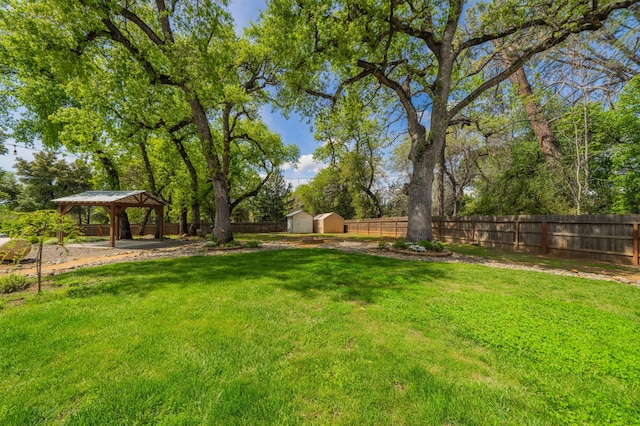 19702 Midland Dr, Redding, CA 96003 - view of yard with a gazebo, a shed, a fenced backyard, and an outdoor structure