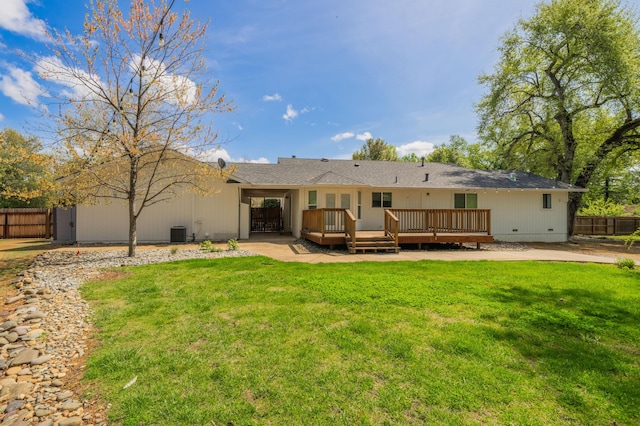19702 Midland Dr, Redding, CA 96003 - rear view of house with a deck, a yard, fence, and crawl space