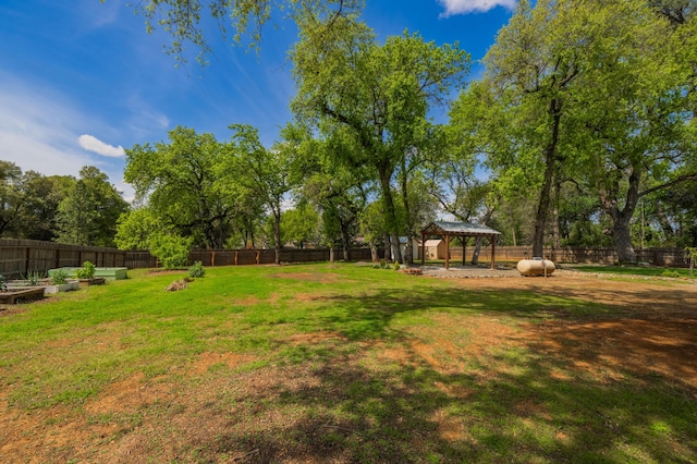 19702 Midland Dr, Redding, CA 96003 - view of yard featuring a garden, a gazebo, and a fenced backyard