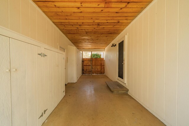19702 Midland Dr, Redding, CA 96003 - corridor with concrete floors and wooden ceiling