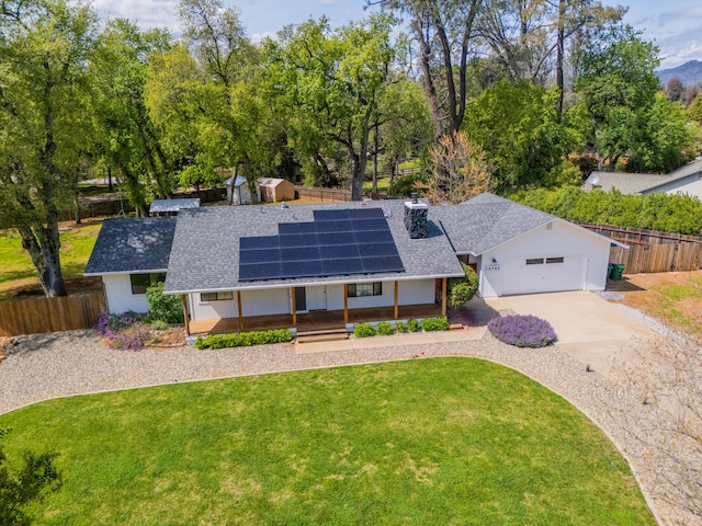 19702 Midland Dr, Redding, CA 96003 - single story home with roof with shingles, driveway, a front lawn, solar panels, and fence