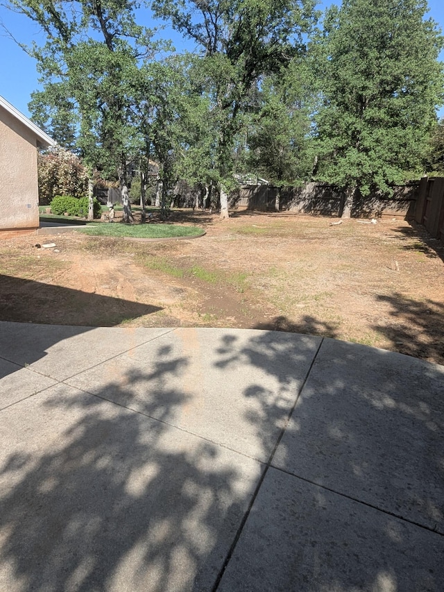 view of yard with a patio area and fence
