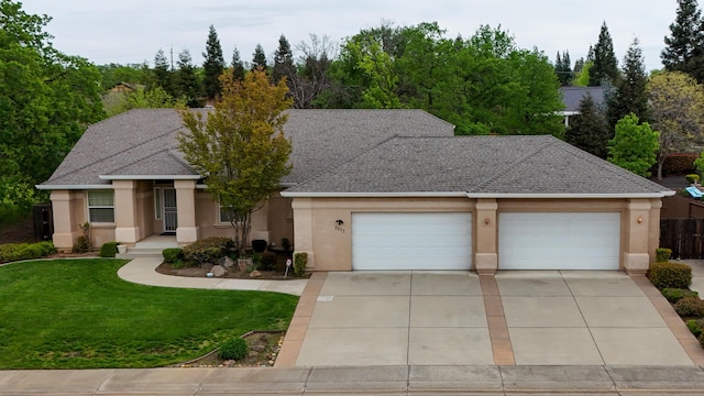 single story home featuring concrete driveway, roof with shingles, stucco siding, an attached garage, and a front lawn