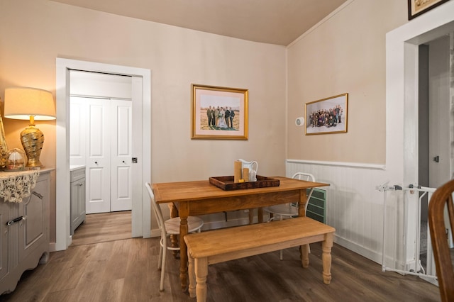 1711 Shasta St, Anderson, CA 96007 - dining space with light wood-type flooring and a wainscoted wall
