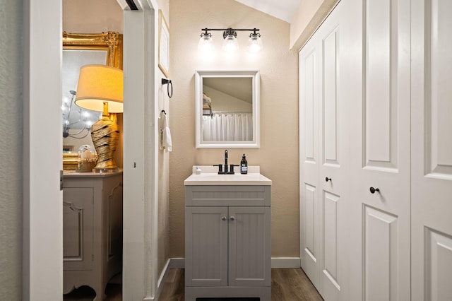 1711 Shasta St, Anderson, CA 96007 - bathroom with baseboards, wood finished floors, and vanity