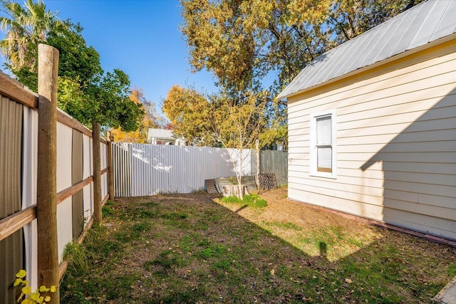 view of yard with a fenced backyard