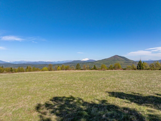 mountain view featuring a rural view