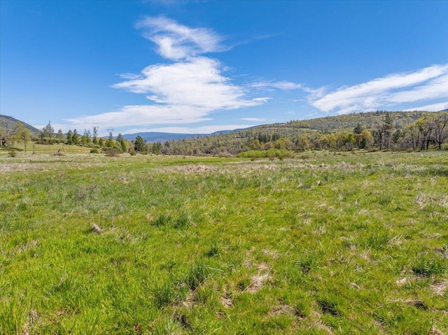 property view of mountains featuring a rural view