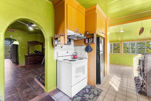 kitchen with arched walkways, ceiling fan, under cabinet range hood, white electric range oven, and tile patterned floors