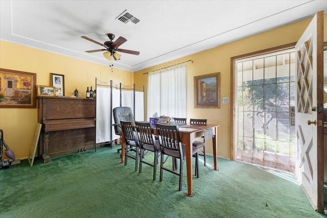 carpeted dining space featuring visible vents, ceiling fan, and plenty of natural light