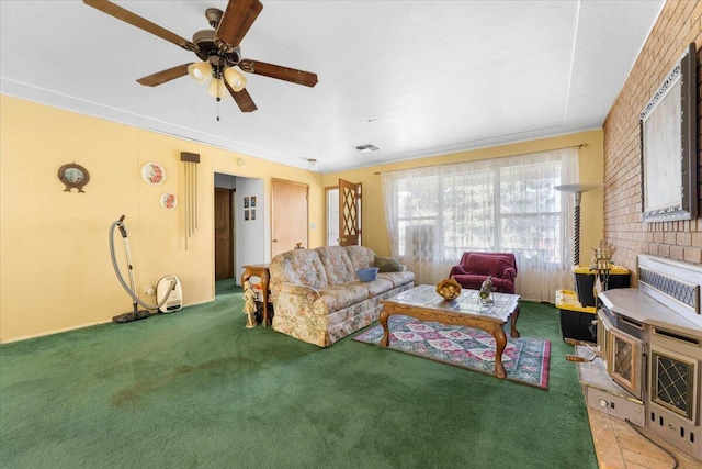 living room with visible vents, a ceiling fan, and carpet