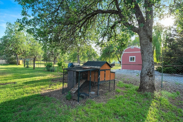 view of poultry coop with fence and a yard