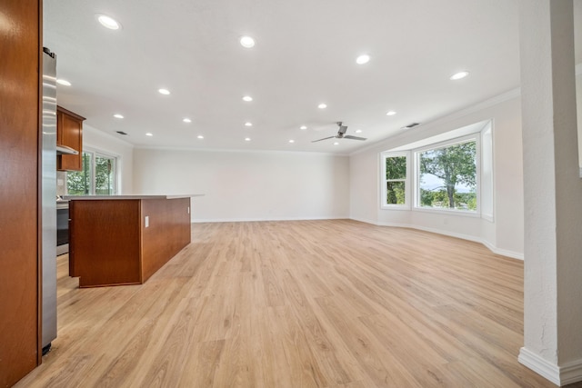 unfurnished living room featuring light wood-style flooring, recessed lighting, baseboards, ceiling fan, and crown molding