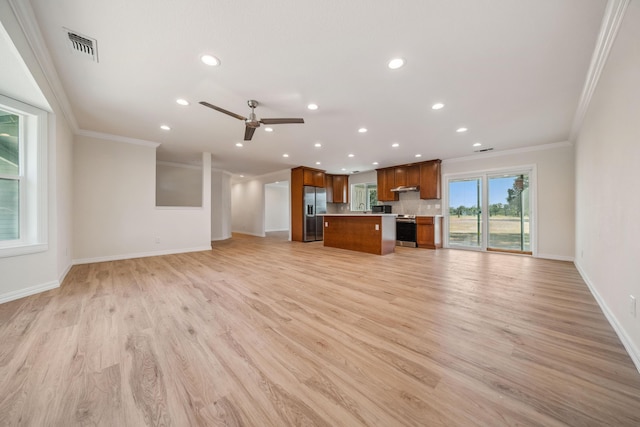 unfurnished living room featuring ornamental molding, baseboards, light wood-style flooring, and recessed lighting