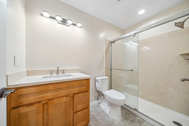 bathroom with vanity, toilet, tile patterned flooring, and a shower stall