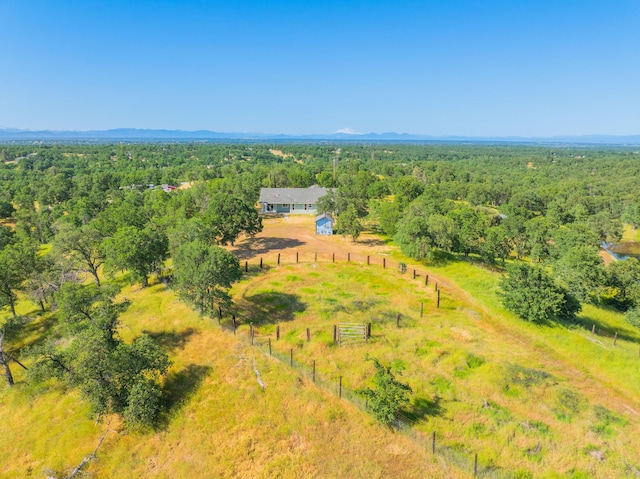 birds eye view of property featuring a rural view and a view of trees
