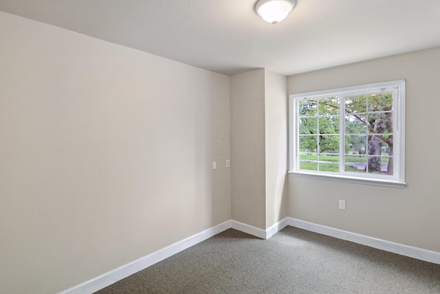 9400 Placer Rd, Redding, CA 96001 - unfurnished room featuring dark carpet and baseboards