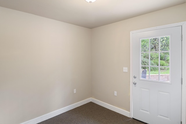 9400 Placer Rd, Redding, CA 96001 - entryway featuring baseboards and dark carpet