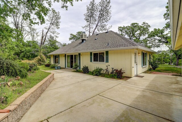 9400 Placer Rd, Redding, CA 96001 - back of house featuring a shingled roof and central AC unit