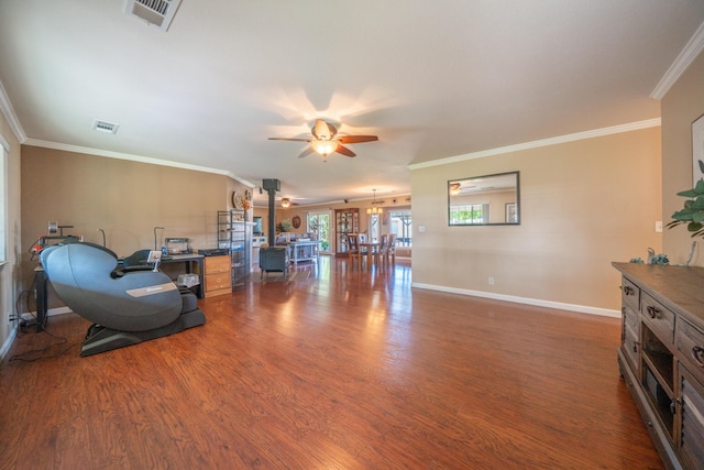interior space featuring wood finished floors, visible vents, baseboards, and a ceiling fan