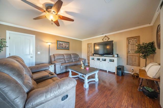 living room with crown molding, baseboards, wood finished floors, and a ceiling fan