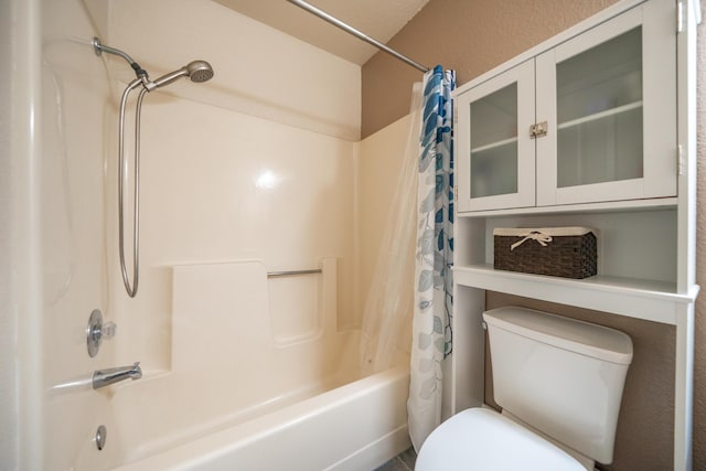 full bath featuring toilet and shower / bath combo with shower curtain