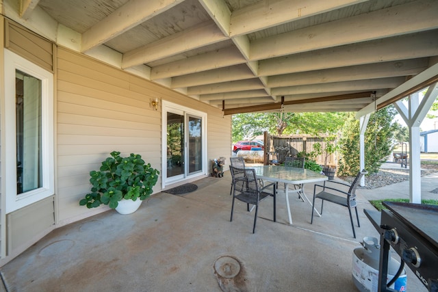 view of patio / terrace with outdoor dining area and fence