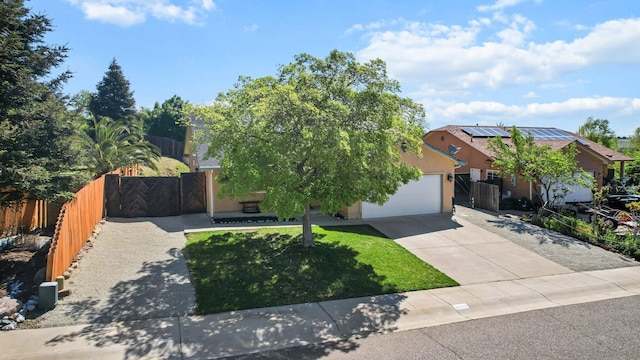 obstructed view of property featuring stucco siding, fence, a gate, an attached garage, and concrete driveway