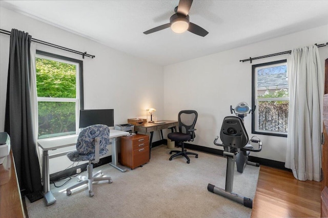 office featuring ceiling fan and a healthy amount of sunlight