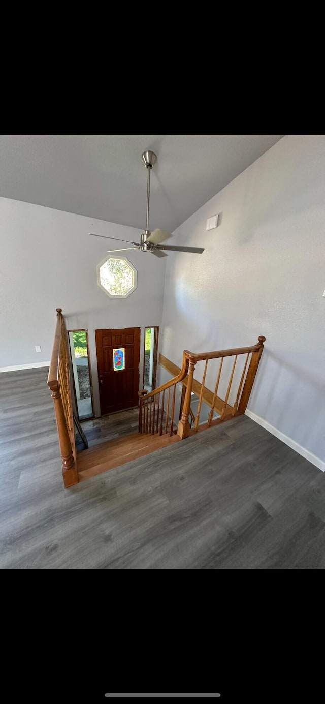 entryway featuring baseboards, ceiling fan, and wood finished floors