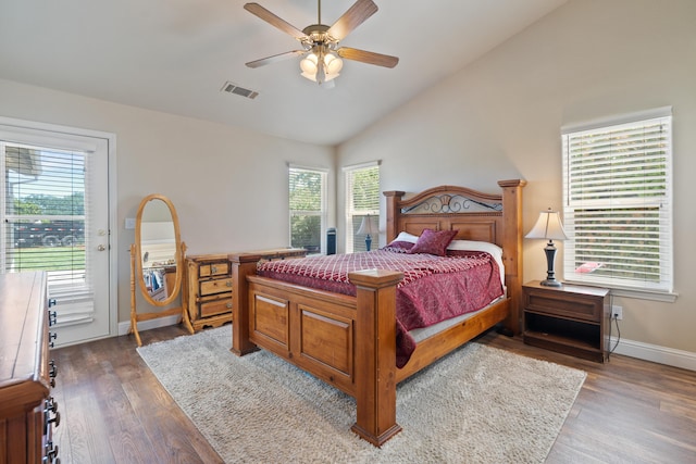 bedroom with visible vents, baseboards, vaulted ceiling, wood finished floors, and access to outside