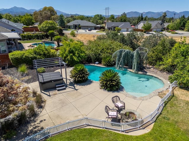 2120 Tradition Way, Redding, CA 96001 - view of swimming pool featuring a mountain view, a fenced backyard, and a patio area