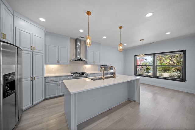 2120 Tradition Way, Redding, CA 96001 - kitchen with stainless steel appliances, wall chimney exhaust hood, light wood-style flooring, light countertops, and recessed lighting