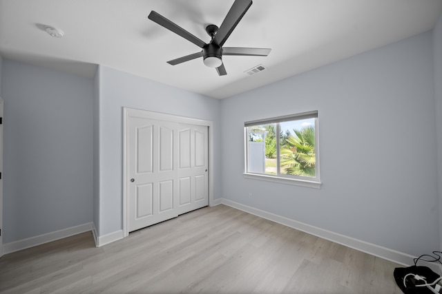 2120 Tradition Way, Redding, CA 96001 - unfurnished bedroom featuring light wood-style floors, a closet, and ceiling fan