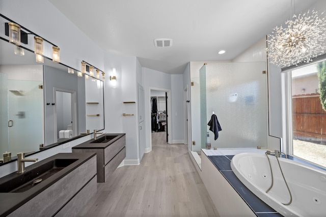 2120 Tradition Way, Redding, CA 96001 - bathroom featuring a shower stall, wood finished floors, vanity, a jetted tub, and recessed lighting