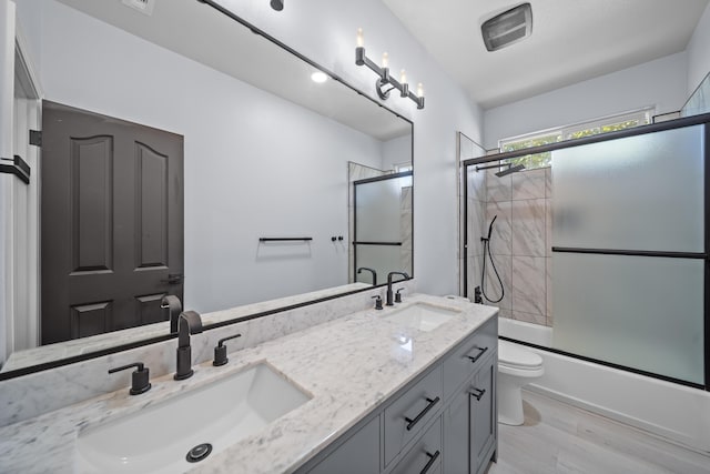 2120 Tradition Way, Redding, CA 96001 - full bathroom featuring double vanity, enclosed tub / shower combo, and wood finished floors