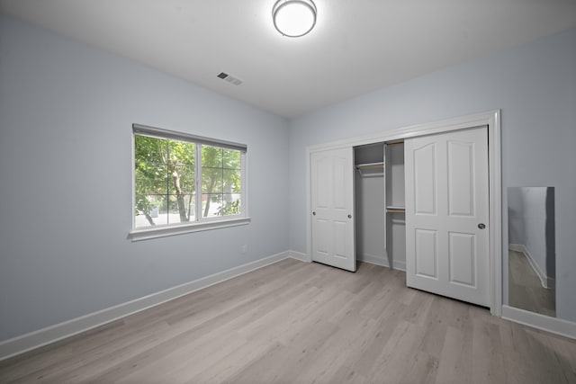 2120 Tradition Way, Redding, CA 96001 - unfurnished bedroom with light wood-style floors and a closet