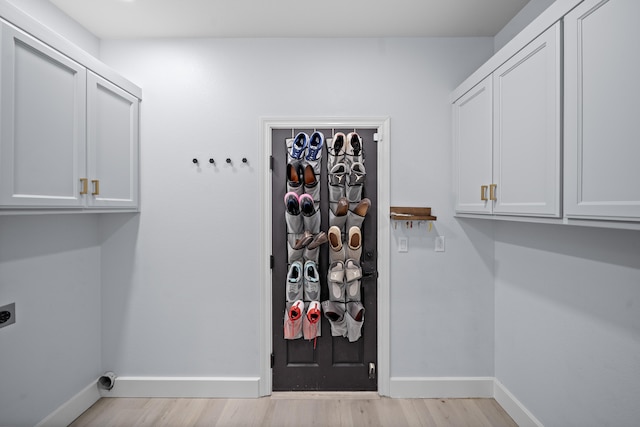 2120 Tradition Way, Redding, CA 96001 - washroom with cabinet space, light wood-style floors, and hookup for an electric dryer
