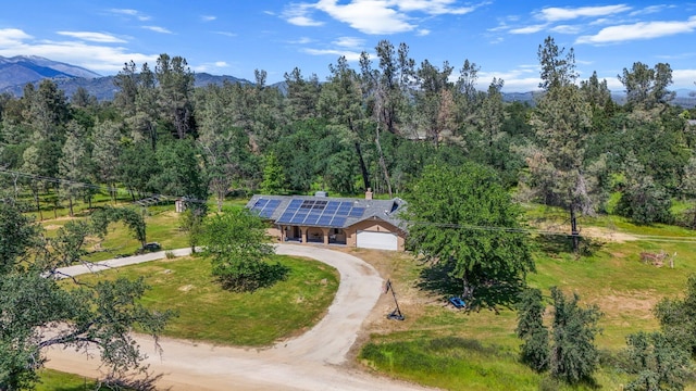 aerial view featuring a mountain view and a forest view